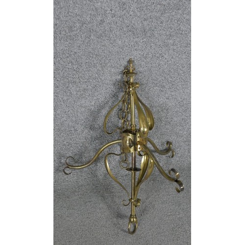 460 - Two early 20th century three branch brass ceiling lights, one with floral swag design and the other ... 