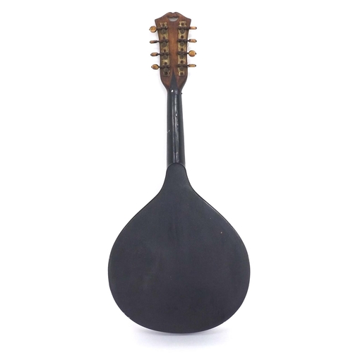 1061 - Flatback mandolin bearing a Rose & Co Bombay import label, soft bag (restorations)