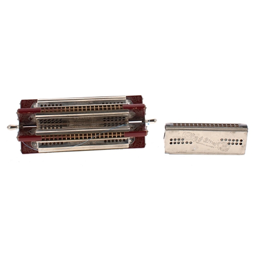 1217 - Rare Hohner six-way paddle wheel harmonica; together with a Breinl tremolo concert harmonica (2)