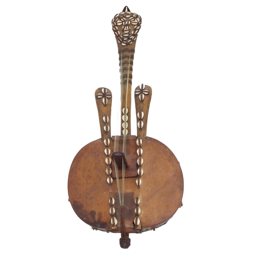 1238 - Interesting West African twelve string kora harp, with hide covered gourd back and decorated with co... 