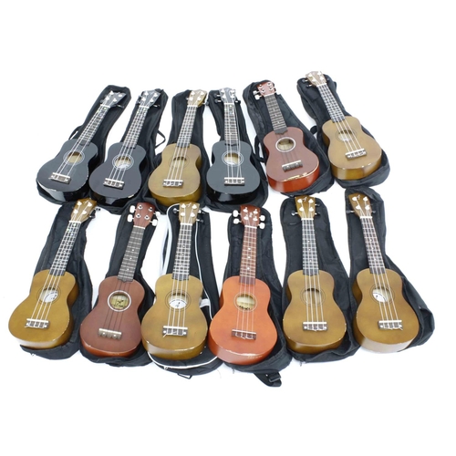 1236 - Twelve contemporary ex-student played ukuleles in variable condition, all in soft bags (12) *This lo... 