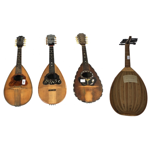 1257 - Three old Neapolitan mandolins in need of restoration, one labelled Carlo Cristini and the other two... 