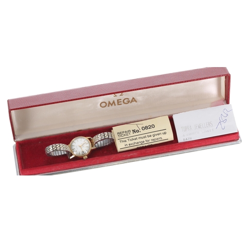 13 - Omega Genéve automatic gold plated and stainless steel lady's bracelet watch, ref. 566.002, serial n... 