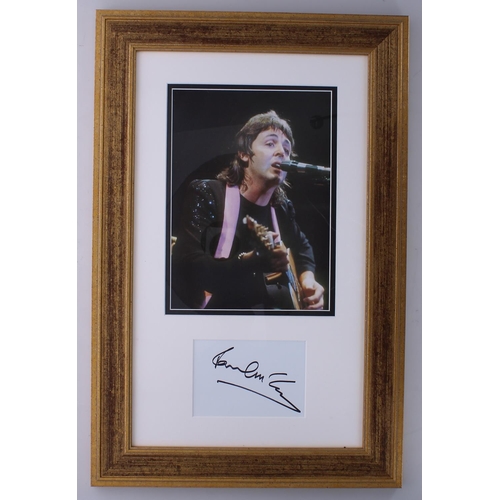 548 - Paul McCartney - autographed page, framed and mounted beneath a colour picture, 23