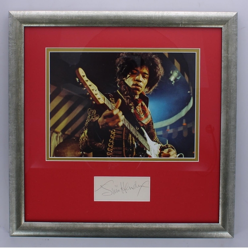 549 - Jimi Hendrix - autographed page, mounted and framed beneath a colour picture, 17