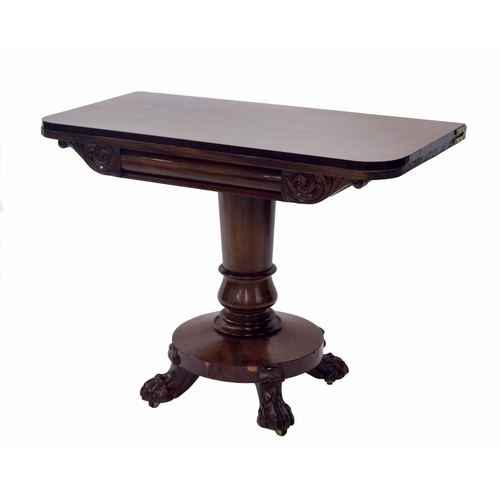 Victorian mahogany fold-over tea table, the hinged top over foliate scrolled carved apron, raised upon a turned support on carved paw feet and brass castors, 39" wide extended, 39" deep, 29" high