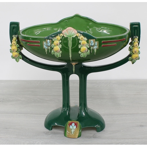 10 - Large Eichwald Art Nouveau glazed pottery centrepiece, with moulded fruit swags and geometric border... 