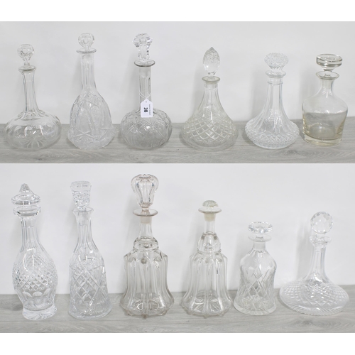 38 - Selection of 12 assorted glass decanters with stoppers, tallest 14