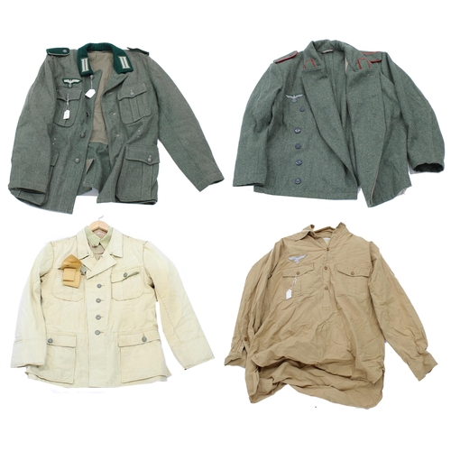 58 - Two reproduction German military dress tunics; together with a reproduction Luftwaffe DAK shirt and ... 