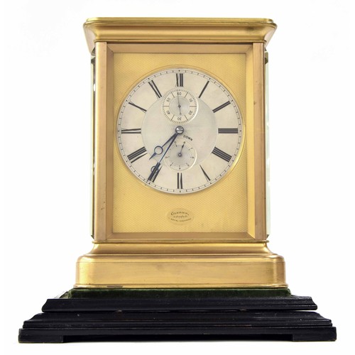 Exceptional gilt-brass giant mantel chronometer of exhibition quality with Kullberg's flat rim balance, the dial signed Clerke, 1 Royal Exchange within an oval cartouche to the bottom of the engine turned gilt mask, the 6" silvered chapter ring with painted Roman numerals and blued steel hands, the engine turned centre with subsidiary dials for seconds and up/down, six dial feet to the substantial movement secured by five gilt brass pillars with blued steel screws to the front and back plates, the rose-gilt large rectangular platform with blued steel helical spring high quality Earnshaw spring detent escapement with jewelled locking stone, the Kullberg Hybrid balance wheel with bimetallic flat rim, wedge shaped heat compensation weights and outer timing screws, the high quality wheel train with maintaining power to the massive chain fusee, polished steel arbours and pinions, the case with moulded base, heavy bevelled glasses to the sides and similarly glazed top, the rear door with securing latch to the base and bevelled glass set with hand-set and winding shutters in the style of Dent, the wheels secured to each arbour by three individual screws with a moulded ebonised turntable base, chronometer 12.25" high; with key