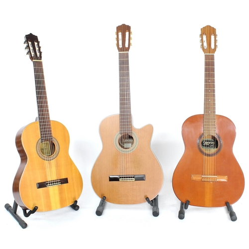 1339 - Landola C-200C nylon string guitar; together with a Giannini classical guitar and a Marina classical... 