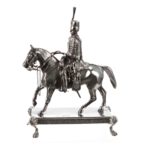 547 - Late Victorian cast silver sculpture of a Royal Horse Guard, finely modelled mounted upon horseback ... 