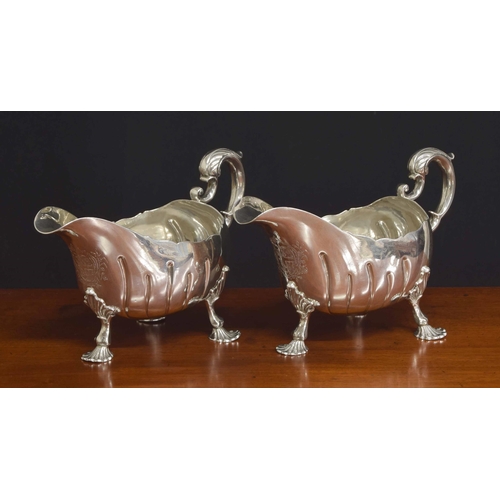 530 - Good pair of George II Irish silver sauce boats, with leaf capped scroll handles, spiral fluted bodi... 