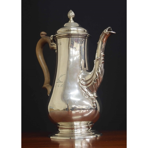 505 - George III silver pear shaped coffee pot, with a fruitwood handle and hinged cover and a spiral flut... 