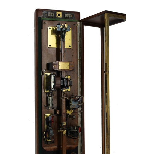 1104 - Interesting and unusual tall electric master wall clock, the electrics and brass bob pendulum housed... 