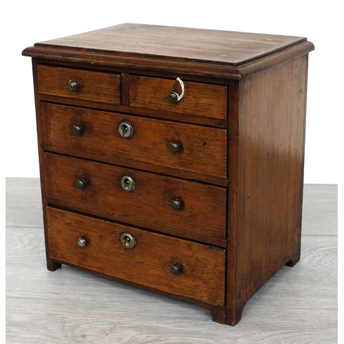 2 - Apprentice miniature oak chest of two short over three long graduated drawers, 8.5