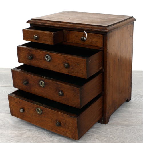 2 - Apprentice miniature oak chest of two short over three long graduated drawers, 8.5