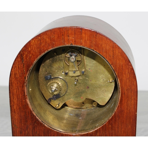 20 - Inlaid mahogany arch-top mantel clock, the 3.5