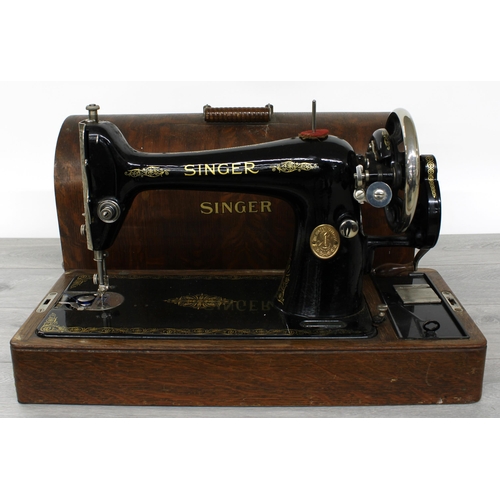 23 - Singer oak cased sewing machine, serial no. Y7999939