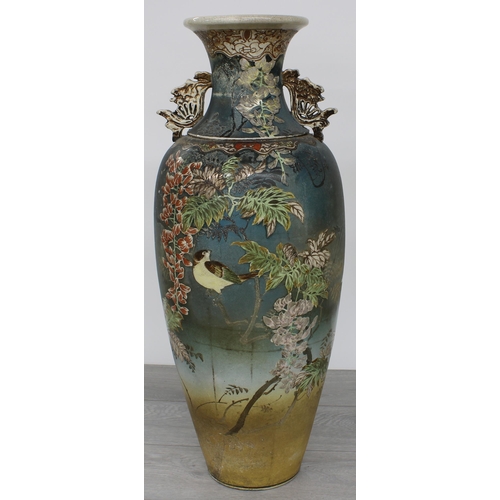38 - Tall Japanese earthenware satsuma style vase, decorated with birds among branches with blossom, 25
