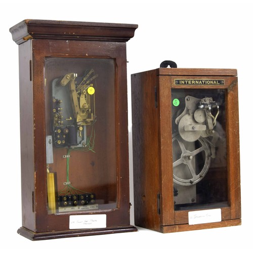1112 - International electric time bell ringer, within an oak glazed case, 16.5