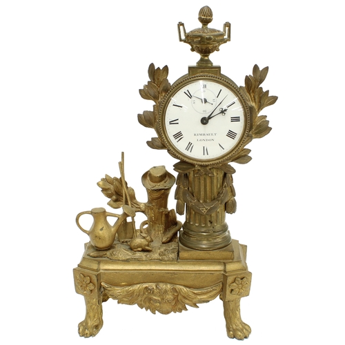 Rare small ormolu pillar mantel clock timepiece, the 2.25" white dial signed Rimbault, London with subsidiary seconds dial, inset into a classical fluted pillar applied with foliage and surmounted by an urn supported upon an oblong base modelled with garden implements and a rabbit, supported upon four paw feet, 10.5" high (key)
