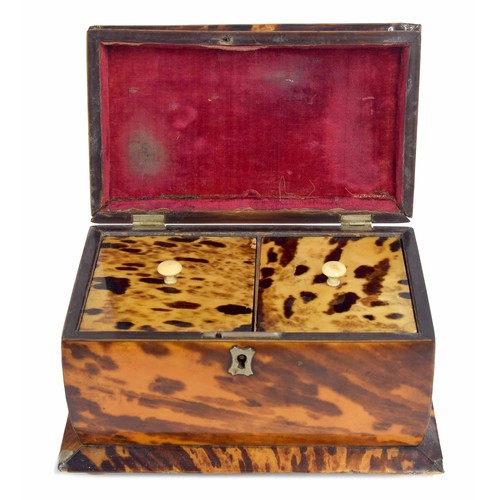 555 - Victorian tortoiseshell tea caddy of sarcophagus form, with a hinged cover enclosing a divided inter... 