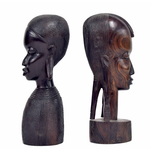 556 - Two similar African carved hardwood busts, 9.5