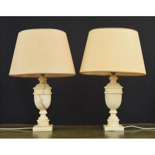 557 - Pair of Italian veined onyx baluster table lamps with oval shades, the lamp bases 14.5