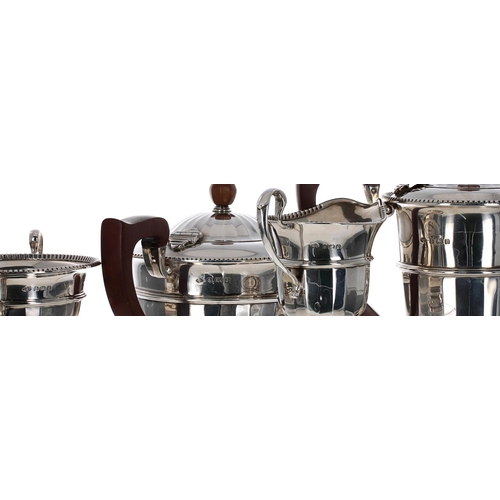 501 - George V silver three piece tea set, half faceted with beaded rims, comprising teapot 5.5
