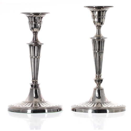 508 - Two similar Victorian oval fluted silver candlesticks, maker William Hutton & Sons, London 1887 ... 
