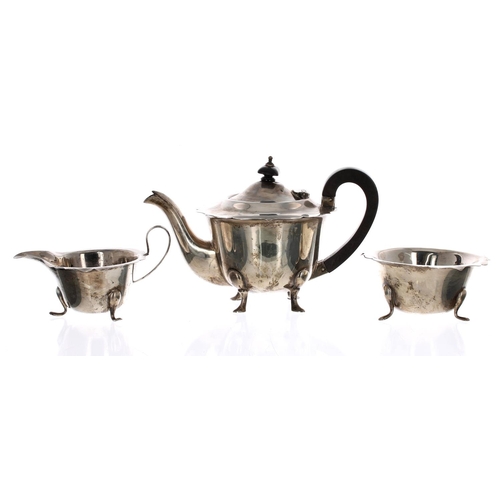 509 - Viner's Ltd. three piece silver tea set, with card cut flared rims, the teapot with a hardwood handl... 