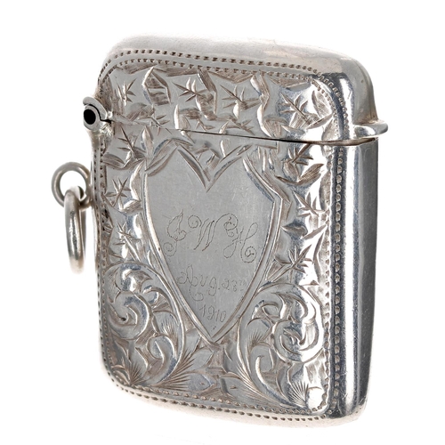 511 - Edwardian silver vesta case, with foliate engraved decorated around a shaped cartouche inscribed 'J.... 