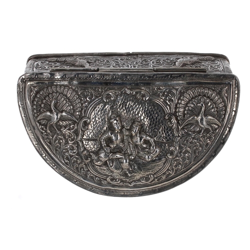 539 - Indian/Burmese silver repousse decorated crescent box, the hinged cover with seated figures and bird... 