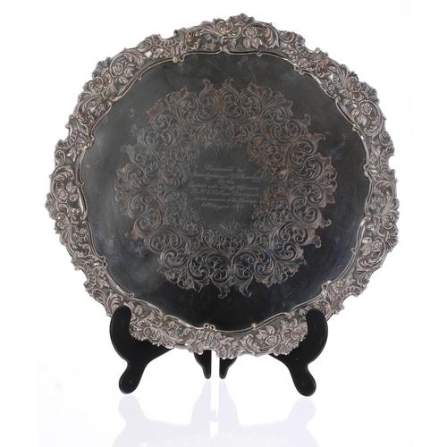 542 - Large cast silver plated circular tray, with scrolling foliate moulded rim and presentation inscript... 