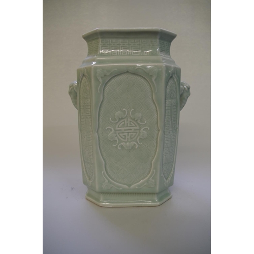 508 - A Chinese celadon twin handled vase, incised with bats and geometric decoration, 26cm high.... 