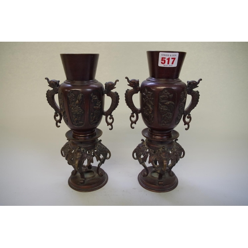517 - A pair of Chinese bronze twin handled vases, 19th century, 25.5cm high.