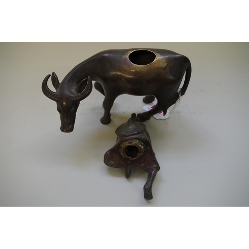 531 - A Chinese bronze buffalo censer and figural cover, 17cm high.