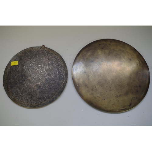 539 - An Oriental bronze circular gong, 23cm diameter; together with a Chinese large hand mirror, 27.... 