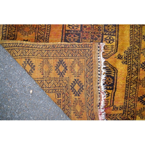 1236 - An old Bokhara rug, having three central medallions to central field, having allover geometric desig... 