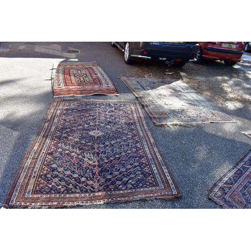 1238 - An old Persian rug, having allover geometric design; together with a similar Persian rug having geom... 