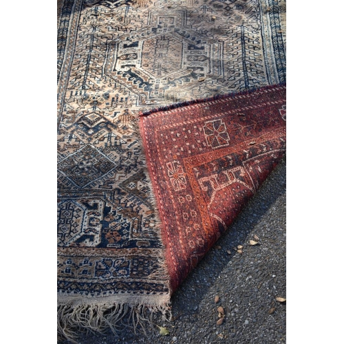 1238 - An old Persian rug, having allover geometric design; together with a similar Persian rug having geom... 