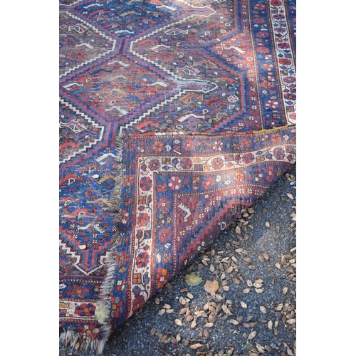 1245 - An old Persian rug, having geometric and floral design; together with a similar Persian rug and... 