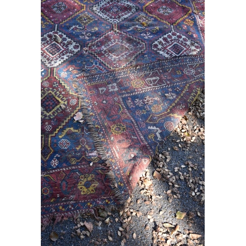 1245 - An old Persian rug, having geometric and floral design; together with a similar Persian rug and... 