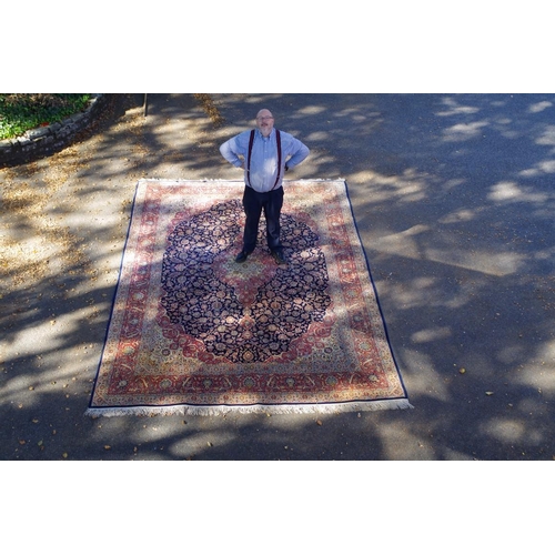 1248 - A fine and large Persian rug, having allover floral design on blue and salmon field, 406 x 297cm.... 