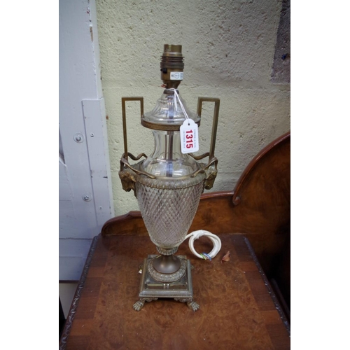 1315 - A brass and cut glass twin handled table lamp, in the Adam style, one foot stamped 'Made in Vienna'.... 