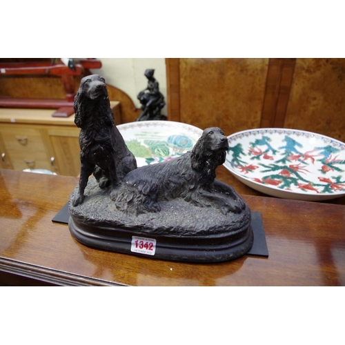 1342 - A bronze figure group of two gun dogs, 27cm wide.
