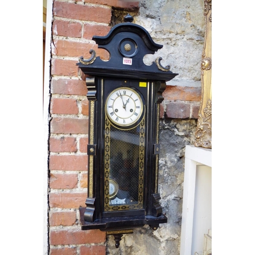 1373 - A late 19th century ebonized Vienna wall clock, spring driven, with pendulum. ... 