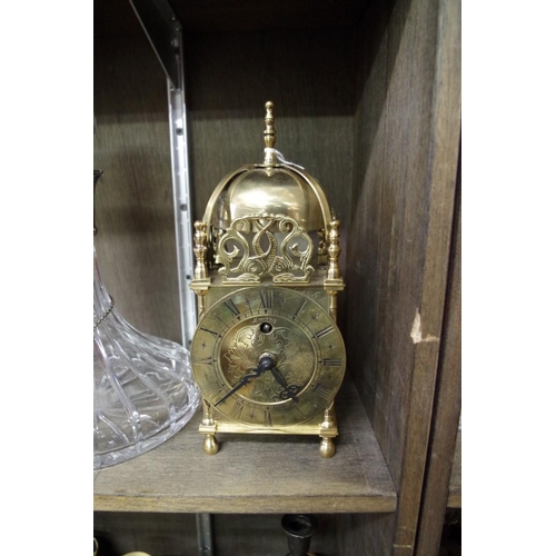 1560 - A small brass lantern style clock by Smiths, 25cm high. 