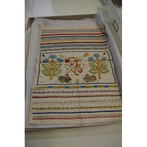 1672 - A Georgian needlework sampler, decorated with a panel of rabbits among flowering branches, with... 